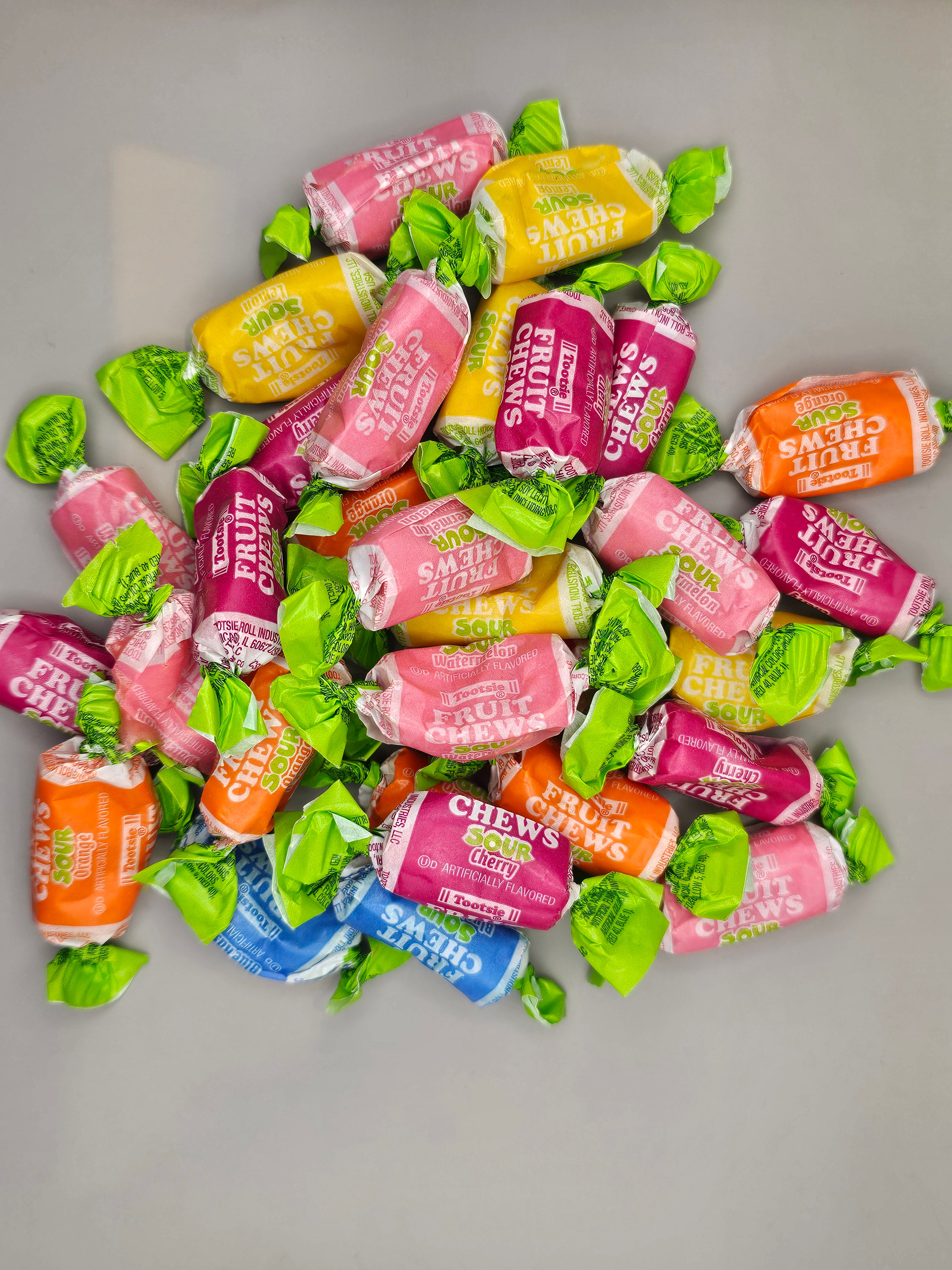 Assorted sour fruit flavor tootsie roll.